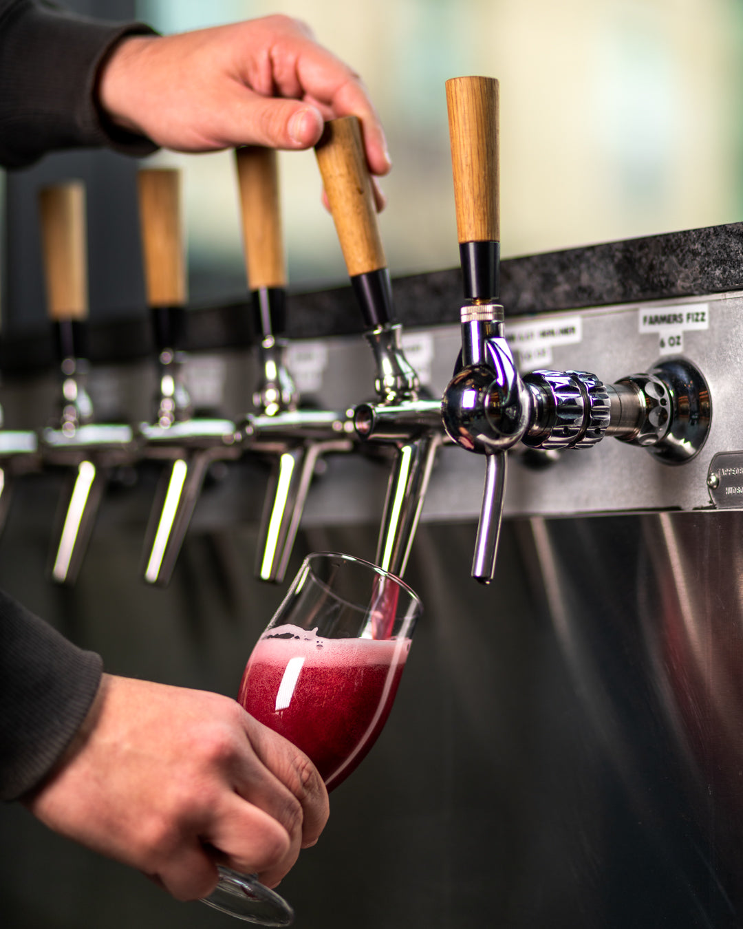Bartender pouring a beer at Trillium Fenway