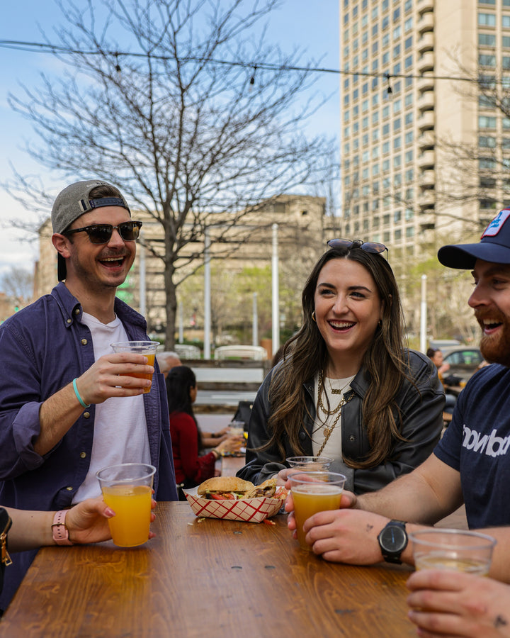 People drinking, eating, and laughing at Trillium Greenway